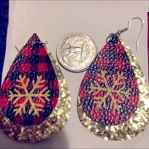 Buffalo plaid snowflake earrings with glitter gold background.